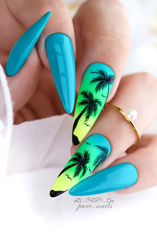 Long almond blue summer nails with two accent tropical ombre blue green and yellow nails adorned with black palm trees