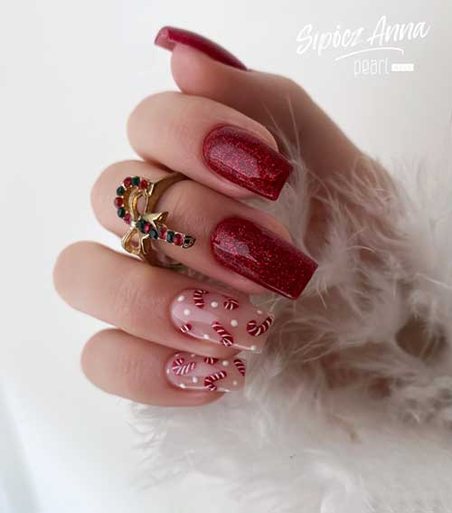 Square-shaped red Christmas nails with sparkle, featuring two nude accent nails adorned with candy cane designs.