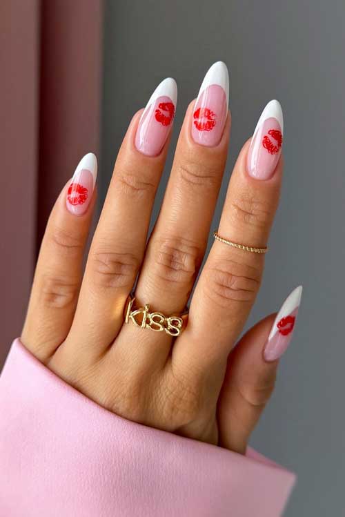 Elegant white French nails with a pink base, featuring long almond shapes and charming red kiss lip designs.