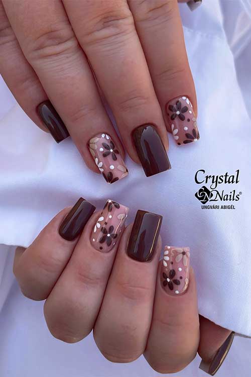 Medium square-shaped brown nails with two elegantly adorned nude accent nails for a stylish manicure.