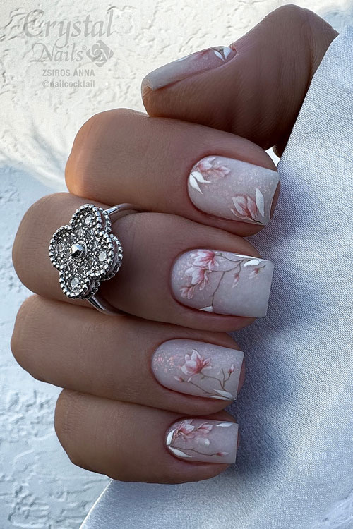 Matte delicate pink floral short spring nails over a nude base color