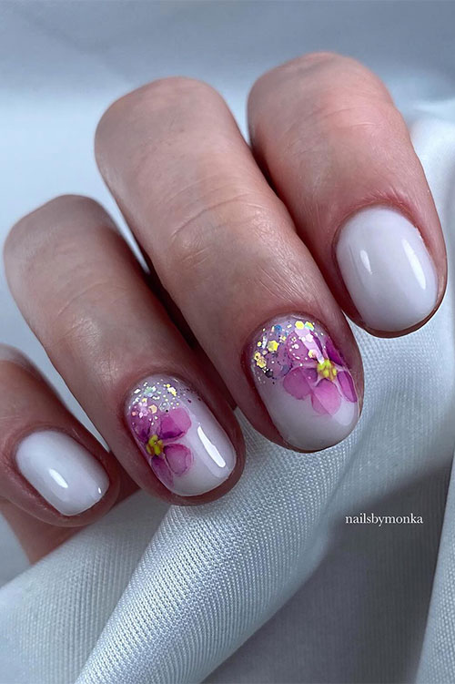 Short gel milky white nails with pink flowers on two accent nails