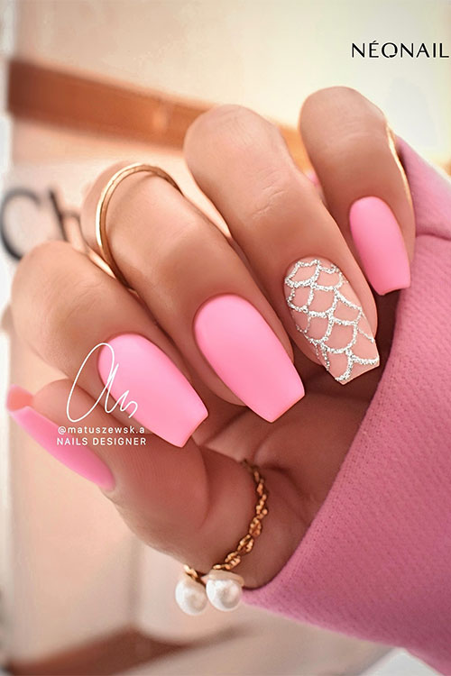 Matte coffin neon pink nails with a nude accent nail adorned with glitter mermaid scales nail art