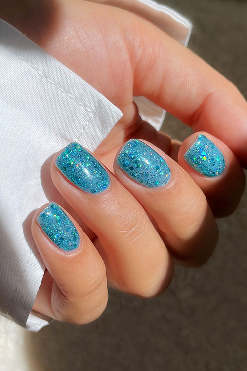 Short tropical blue cute summer nails with glitter