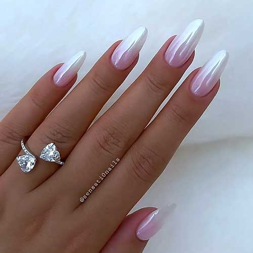 Long almond-shaped pink and white French ombre nails with a chrome layer effect