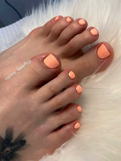 Simple delicate orange pedicure idea