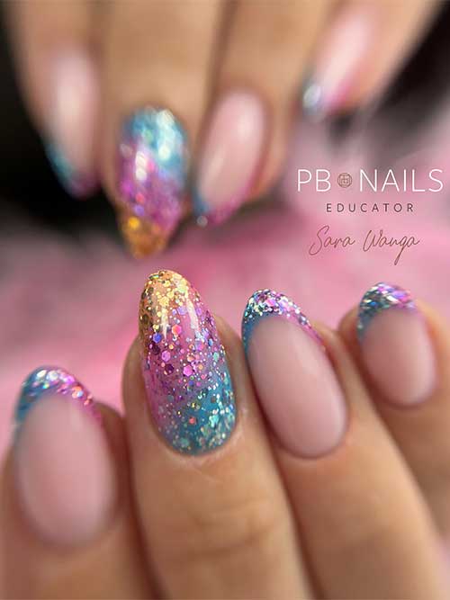 Half and half French nails feature pink and blue decorated with glitter