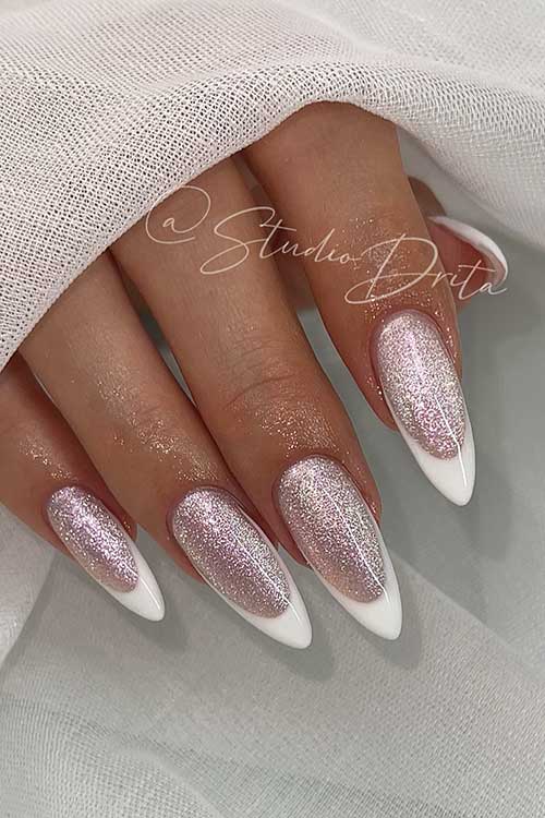 Long almond-shaped modern white French tip nails over rose gold glitter base color