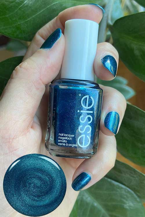 Metallic silver and deep teal nails featuring Essie Never Too Bold from the Fall 2024 Punk at Heart Collection.