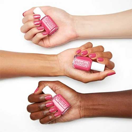 Vibrant pink nails painted with Essie Loud & Proud from the Fall 2024 Punk at Heart Collection, showcasing a bold style.