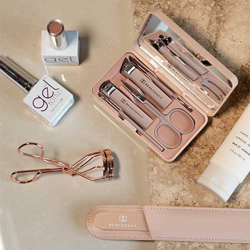 A collection of nail prep tools including files, buffers, and cuticle pushers arranged that are must have nail products