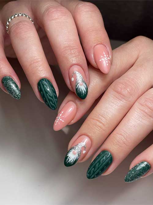 Dark green Christmas nails with glitter, sweater designs, gnome art on a nude accent, and a snowflake on another nude nail.