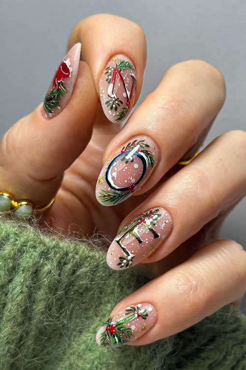 Festive Christmas nails with wreath art on a nude base and "NOEL" lettering, perfect for the holiday season.