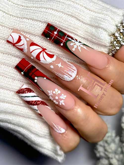 Long French Christmas nails with candy cane designs, icicle art, and two buffalo plaid accent nails featuring snowflakes.