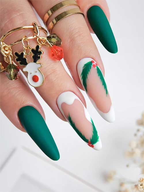 Long matte dark green Christmas nails featuring twisted white French tips on a nude pink base, adorned with wreath art.