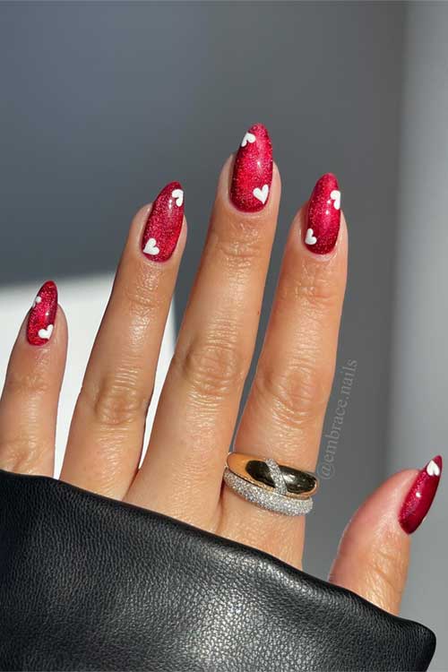 Classic red Valentine heart nails featuring cute white heart designs for a festive and romantic look.