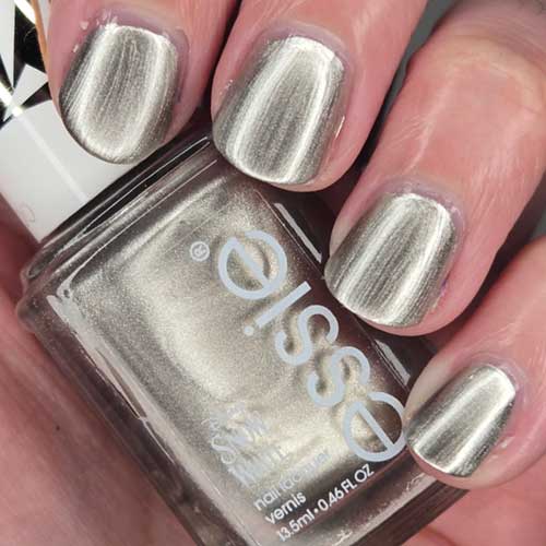 Brushed foil silver polish bottle labeled "Reclaim the Mirror" from essie x Disney's Snow White Collection.