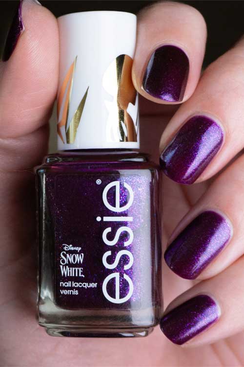 Deep eggplant purple nail polish named "Tempted with Envy" from essie x Disney's Snow White Collection.